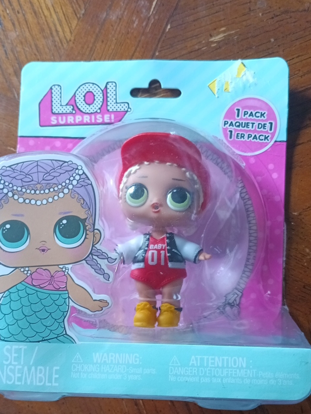 L.O.L. Surprise! Doll with Red Hat, Pink Packaging, Yellow Boots